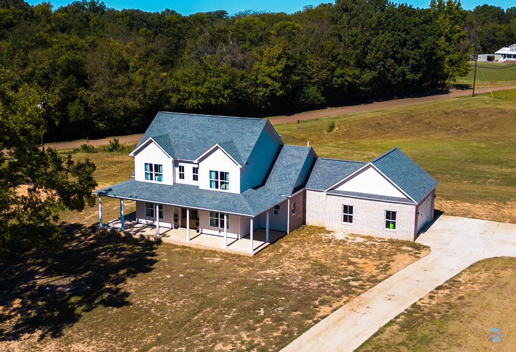 Farmhouse Charm Brought to Life: View Our Home Plan #24392 in Real Life